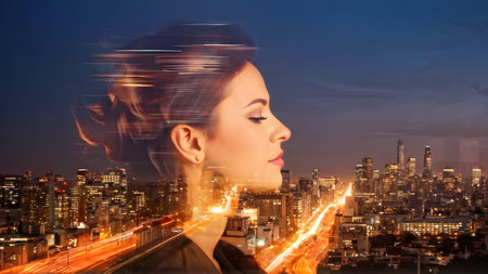 profile of business professional with a double exposure of city lights, representing business success against an evening skyの素材