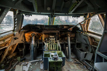 The picture shows an old wrecked airplane cockpitの写真素材