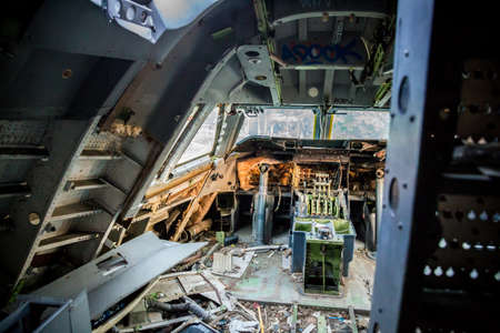 The picture shows an old wrecked airplane cockpitの写真素材