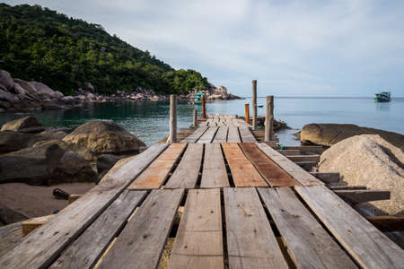 a boardwalk that leads into waterの写真素材