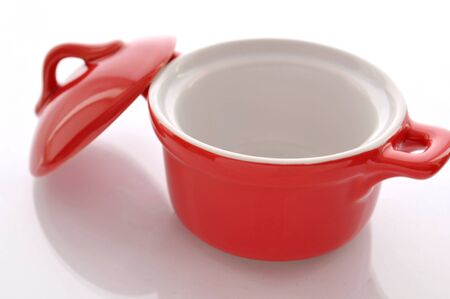 Ceramic, red pan on white backgroundの写真素材