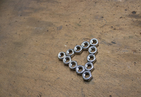 Triangle made of nuts. Copy space
