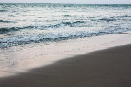Beautiful Waves during Sunset in Porto de Galinhas, Pernambuco, Brazilの写真素材