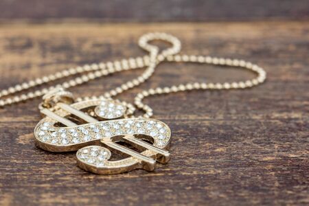 dollar sign on wooden tableの写真素材