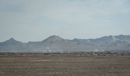 Trash and Rubbish in the dry landscape along the roadside on the Northern coast of Peru, South America.の写真素材