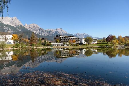 Ritzensee, Saalfelden, Salzburg/Austria, October 26, 2019: View of the nature bath at Ritzensee with the peaks of the Steinernes Meer reflecting in the lake.の写真素材