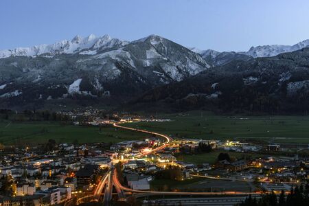 Schuettdorf, Zell am See, Salzburg / Austria, November 11, 2019: View of Sch?tttorf, Zell am See South during the night, from Keilberg, Schmittenhoehe with the Three Brothers mountains in the background. Zell am See, Salzburg, Austria.の写真素材