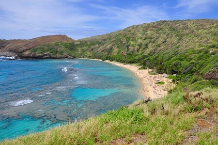 Snorkelling at the coral reef of Hanauma Bay, a former volcanic crater, now a national reserve near Honolulu, Oahu, Hawaii, United States.の写真素材
