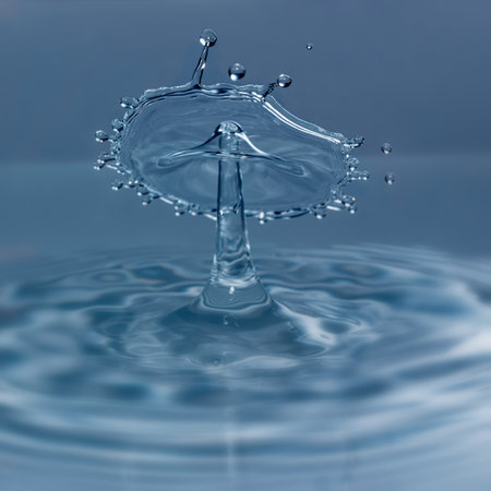 Close-up of splashing water against white backgroundの写真素材
