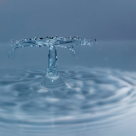 Close-up of splashing water against white backgroundの写真素材