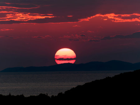 Scenic view of sea against romantic sky at sunsetの写真素材