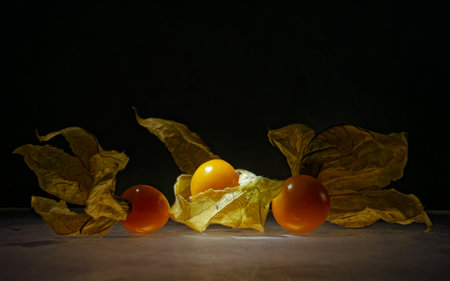 Close-up of fruits on table against black backgroundの写真素材