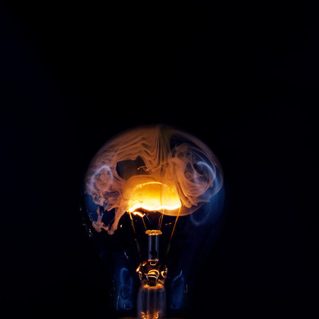 Incandescent light bulb on black background with copy space. Idea concept.の写真素材