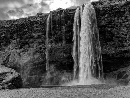 Seljalandsfoss waterfall in southern Iceland in black and whiteの写真素材