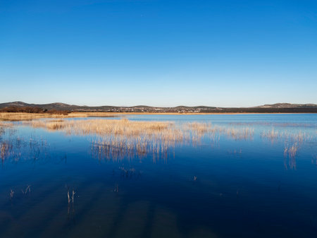 Landscape of lake with blue sky and reflection in water.の写真素材