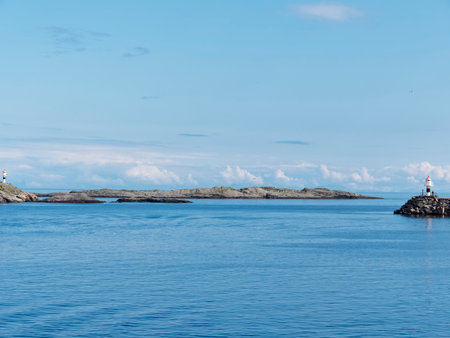 Lighthouse on a rock in the middle of the seaの写真素材