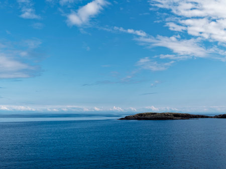 Beautiful seascape with blue sky and white clouds over the seaの写真素材