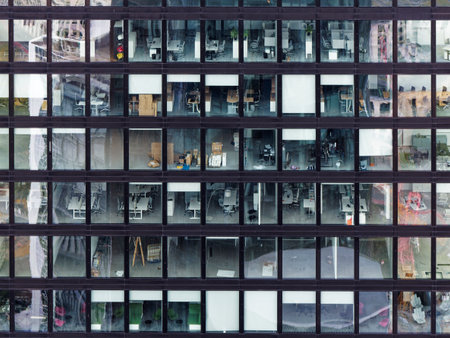 Reflection in the windows of a modern office building in Frankfurt am Main, Germany.の写真素材