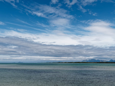 Beautiful seascape with blue sky, sea and mountain backgroundの写真素材