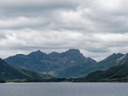 Norwegian fjord landscape with mountains and clouds in summer.の写真素材