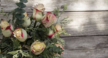 A bouquet of osira roses at a wedding in the countryside of France on Valentines Dayの写真素材