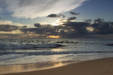 Sunset over the ocean at Pearl Street Beach in Laguna Beach Southern Californiaの写真素材