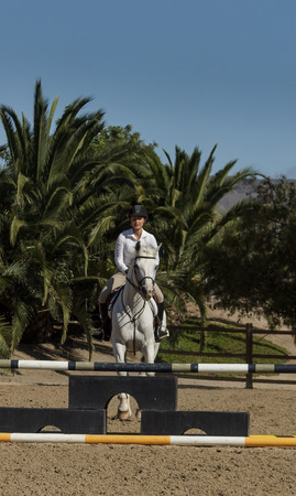 San Juan Capistrano, California, United States  July 26, 2015: Young woman at a public equine event held by the  Laguna Beach Horse Lovers Group. For editorial use only.のeditorial素材