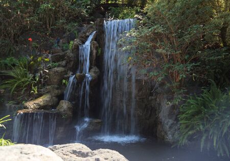 Deep tropical forest waterfall in Hawaii in Springの写真素材
