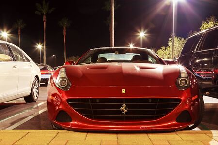 September 6, 2015, Newport Beach, California. Red Ferrari glitters in the lights at night in Crystal Cove. Editorial use onlyのeditorial素材