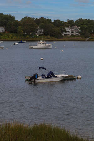 Orleans, Massachusetts  September 23, 2015: boats anchored in a quaint Cape Cod marsh.のeditorial素材