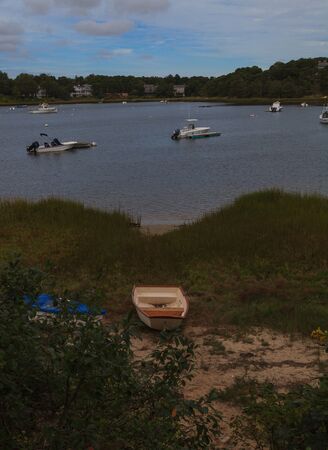 Orleans, Massachusetts  September 23, 2015: boats anchored in a quaint Cape Cod marsh.のeditorial素材