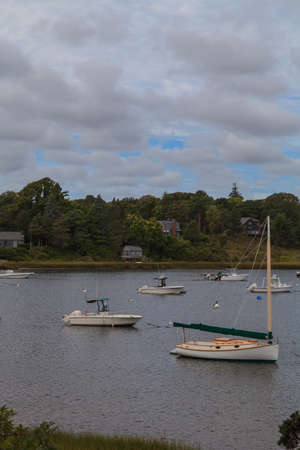 Orleans, Massachusetts  September 23, 2015: boats anchored in a quaint Cape Cod marsh.のeditorial素材