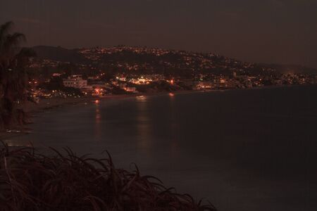 City lights view Laguna Beach at night, from Heisler Park in Laguna Beach, California.の写真素材