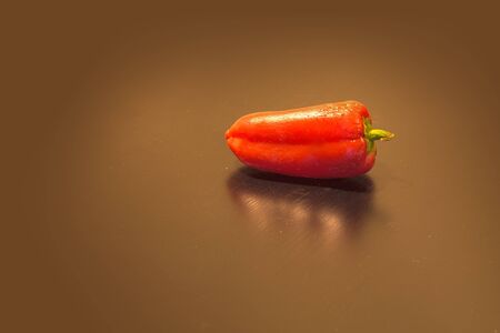 Red, colorful healthy organic peppers on a black backgroundの写真素材