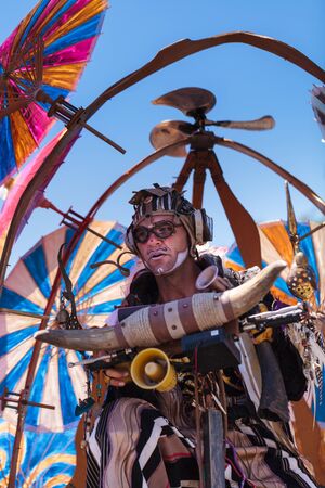 Costa Mesa, California, United States - July 16, 2016: Theatrical circus performer Derrick Gilday, part Mango and Dango, performs with Dragon Knights steampunk stilt walkers at the Orange County Fair in Costa Mesa, CA on July 16, 2016. Editorial use only.のeditorial素材