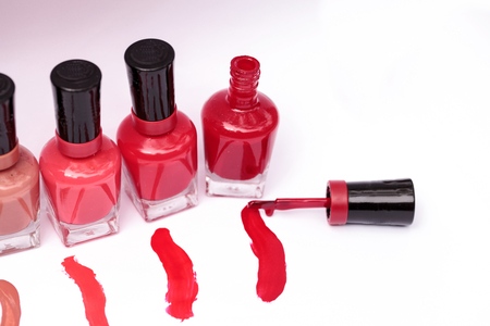 Bright red, pink and white nail polish colorsの写真素材