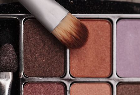 Makeup brush on a textured rustic backgroundの写真素材