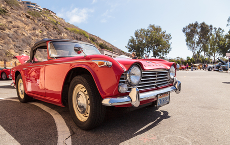 Laguna Beach, CA, USA - October 2, 2016: Red 1967 Triumph TR4A displayed at the Rotary Club of Laguna Beach 2016 Classic Car Show, Editorial use.のeditorial素材
