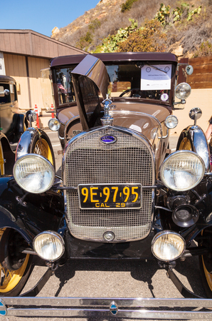 Laguna Beach, CA, USA - October 2, 2016: Tan 1931 Ford Slant Window Town Sedan owned by David and Susie Russell and displayed at the Rotary Club of Laguna Beach 2016 Classic Car Show. Editorial use.のeditorial素材