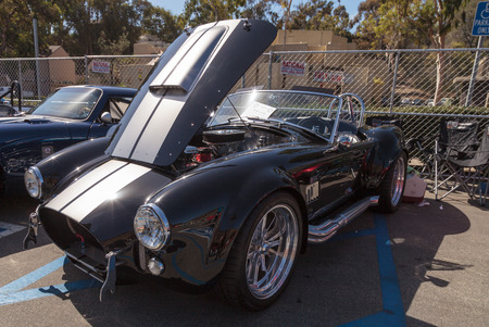 Laguna Beach, CA, USA - October 2, 2016: Black and white 1965 Shelby Cobra owned by Jay and Jean Weil and displayed at the Rotary Club of Laguna Beach 2016 Classic Car Show. Editorial use.のeditorial素材