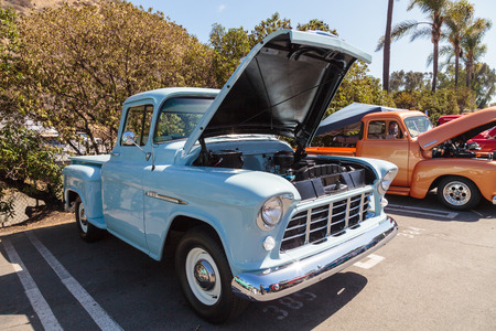 Laguna Beach, CA, USA - October 2, 2016: Light Blue 1955 Chevrolet 3100 Big Window Truck owned by Mike Montoya and displayed at the Rotary Club of Laguna Beach 2016 Classic Car Show. Editorial use.のeditorial素材