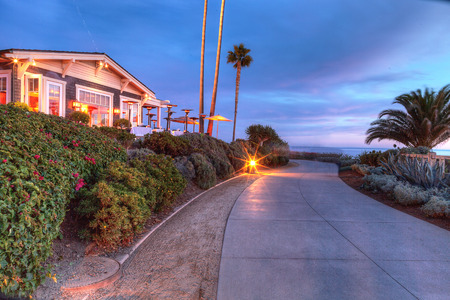 Laguna Beach, CA, USA - October 7, 2016: Sunset view of ocean view restaurant at night at the Montage in Laguna Beach, California, United Statesのeditorial素材