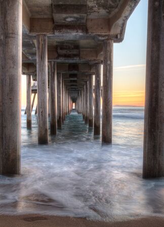 HDR Sunset behind the Huntington Beach pier in Southern Californiaの写真素材