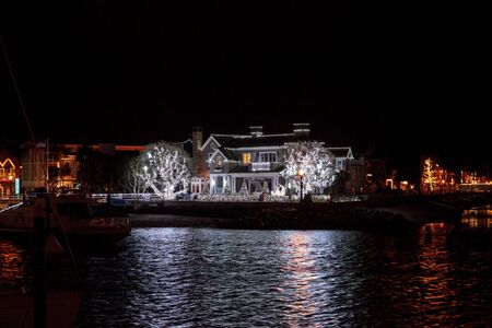 Colorful holiday lights on a home along the harbor at Balboa Island.の写真素材