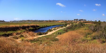 Upper Newport Bay Nature Preserve hiking trail winds along the marsh, where you will see wildlife in Newport Beach, California USAの写真素材