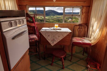 Small retro caravan camper used as a tiny house on road trips to the mountains and the beach on the weekends.  Photo done in HDR.の写真素材