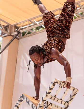 San Diego, CA, USA â July 1, 2017: Acrobatic performance of the Zuzu African acrobats at the San Diego Zoo Safari park. Editorial only.のeditorial素材