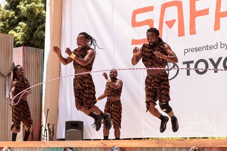 San Diego, CA, USA â July 1, 2017: Acrobatic performance of the Zuzu African acrobats at the San Diego Zoo Safari park. Editorial only.のeditorial素材