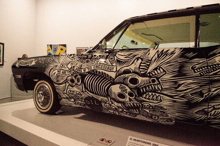 Los Angeles, CA, USA - July 23, 2017: Black and white 1968 Chevrolet Impala lowrider called El Muertorider by artists Artemia Rodriguez and John Jota Leanos displayed at the Petersen Automotive Museum. Editorial use.のeditorial素材