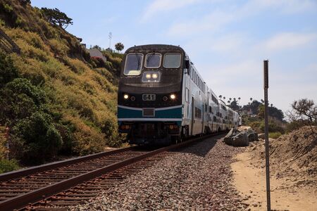 San Clemente, CA, USA â July 31, 2017: Train moves along tracks that run through San Clemente State Beach in Southern California in summer. Editorial use.のeditorial素材